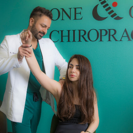 Dr. Hirbod Azizi providing professional chiropractic treatment at One & Only Chiropractic